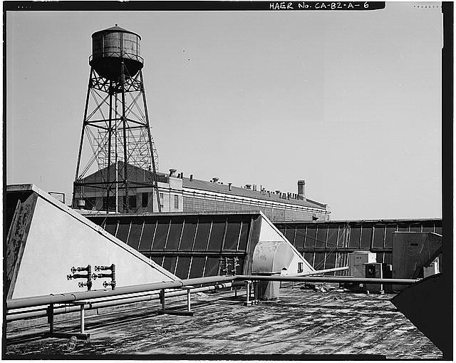 Ford Long Beach Assembly Plant SAWTOOTH WINDOW RANKS ABOVE ASSEMBLY LINES, WATER TOWER, AND SECOND FLOOR WAREHOUSE STRUCTURE. VIEW TO SOUTH-SOUTHEAST. 