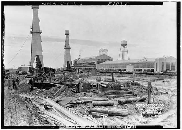 Ford Long Beach Assembly Plant Mar 16, 1937, EXTERIOR-FORD ASSEMBLY PLANT EAST SIDE, SHOWING OIL WELL #6 IN THE FOREGROUND, NORTHEAST OF THE ASSEMBLY PLANT 