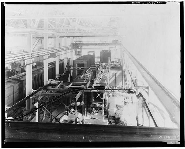 Ford Long Beach Assembly Plant Dec 27, 1931, INTERIOR-PRESSED STEEL BUILDING, EAST SIDE FACING NORTH, SHOWING MACHINERY, CONVEYOR LINES, AND RAILROAD CARS 