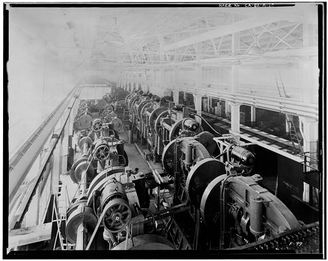 Ford Long Beach Assembly Plant Dec 27, 1931, INTERIOR-PRESSED STEEL BUILDING FACING SOUTH TOWARD WAREHOUSE AND ASSEMBLY BUILDING 1ST FLOOR, EAST SIDE FACING SOUTH, SHOWING PRESSED STEEL MACHINERY AND RAILROAD CARS