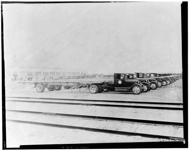 Ford Long Beach Assembly Plant Aug 11, 1930, EXTERIOR-ASSEMBLY BUILDING, NORTH SIDE, WITH TAYLOR-TRUCK-A-WAY TRUCKS AND TRAILORS 